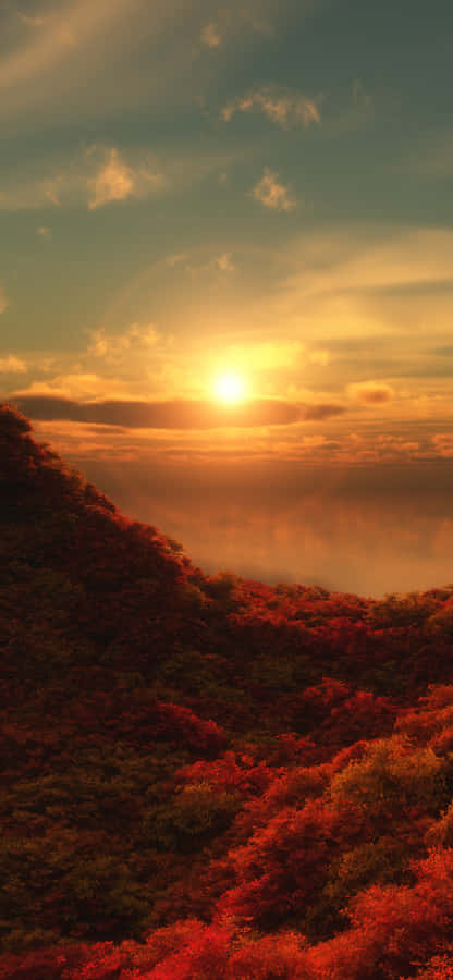 A Lonely Red Tree Standing Tall In A Serene Meadow Wallpaper