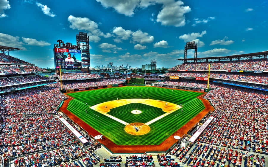 A Magnificent Baseball Stadium Under The Mesmerizing Evening Sky Wallpaper