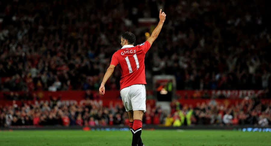 A Man In Red Shirt Is Celebrating His Goal Wallpaper