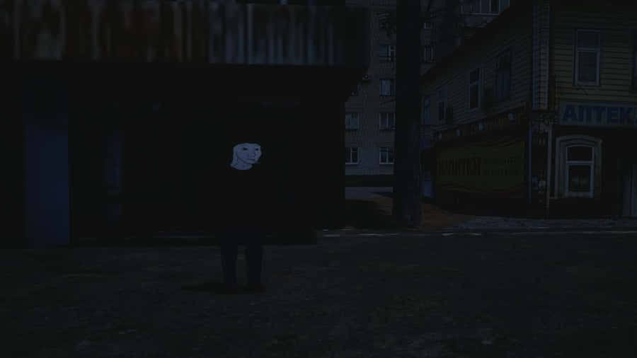 A Man Standing In A Dark Street Wallpaper