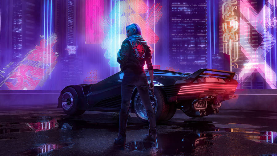 A Man Standing In Front Of A Car In A City Wallpaper