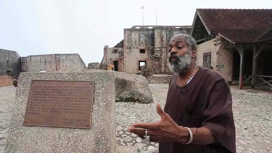 A Man Stands At The Citadelle Laferriere Wallpaper