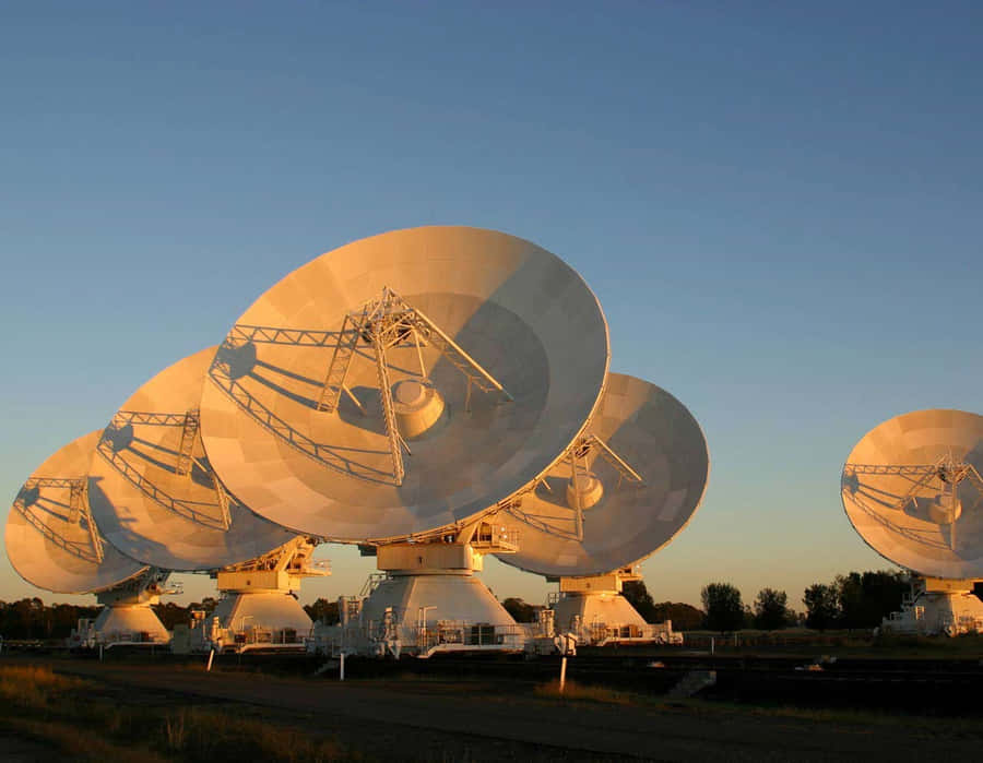A Massive Radio Telescope Scanning The Night Sky Wallpaper
