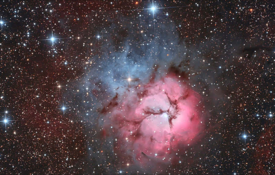 A Mesmerizing Star Shining Brightly In The Night Sky Wallpaper