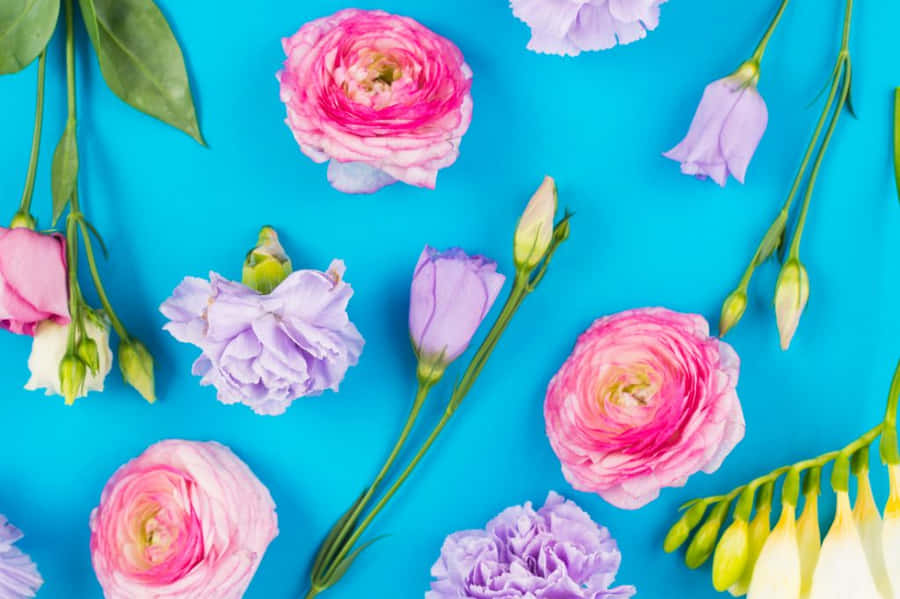 A Mesmerizing View Of A Waterfall Cascading Down A Cliff Wallpaper