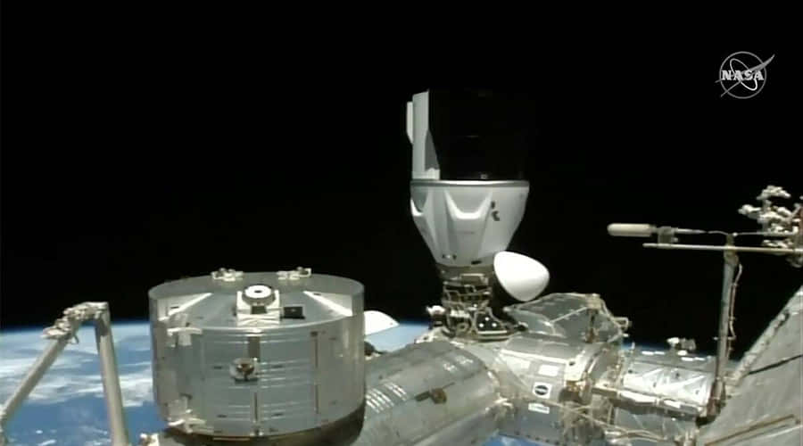 A Mesmerizing View Of The International Space Station Orbiting Earth Wallpaper