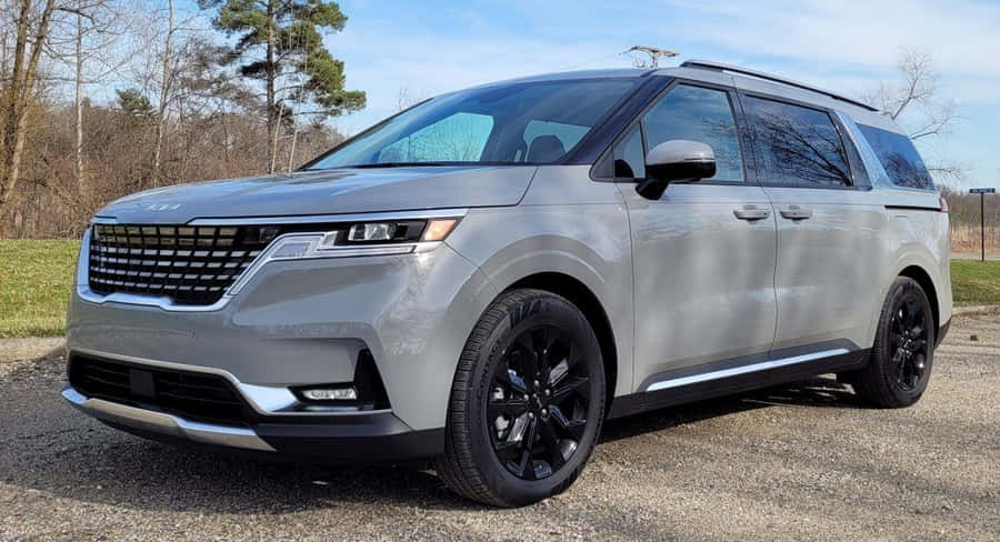 A Modern Family Car Parked In A Picturesque Suburban Neighborhood Wallpaper