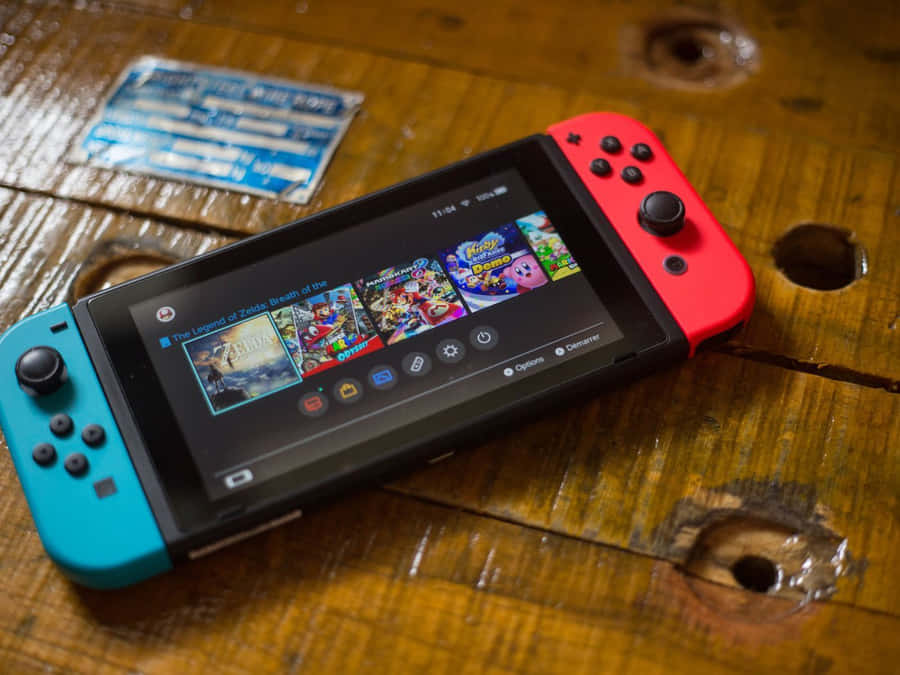 A Modern Gaming Console Collection With Controllers Wallpaper