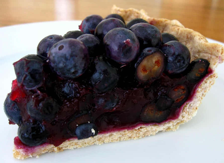 A Mouth-watering Blueberry Pie, Freshly Baked And Still Steaming Hot Wallpaper
