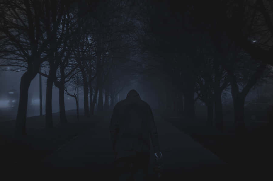 A Mysterious Dark Road At Twilight Wallpaper