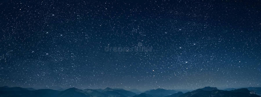 A Nighttime View Of The Majestic Mountains Wallpaper