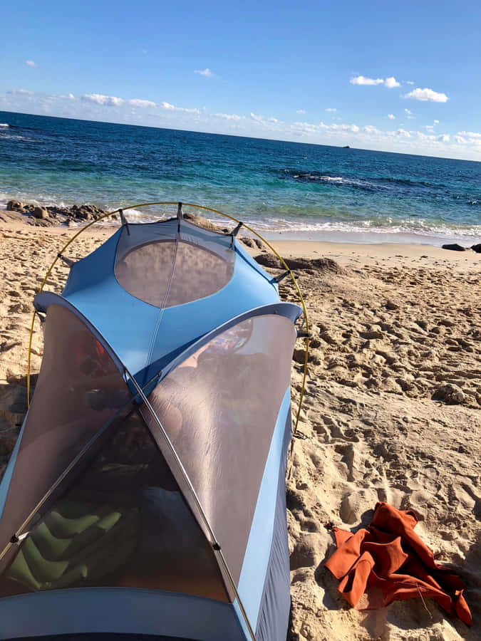 A Peaceful Beach Camping Experience Wallpaper