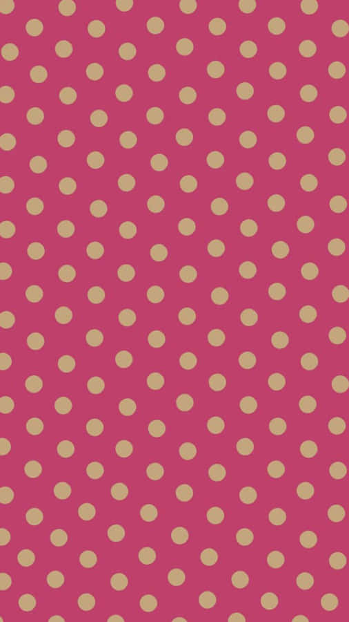 A Pink And Gold Polka Dot Pattern Wallpaper