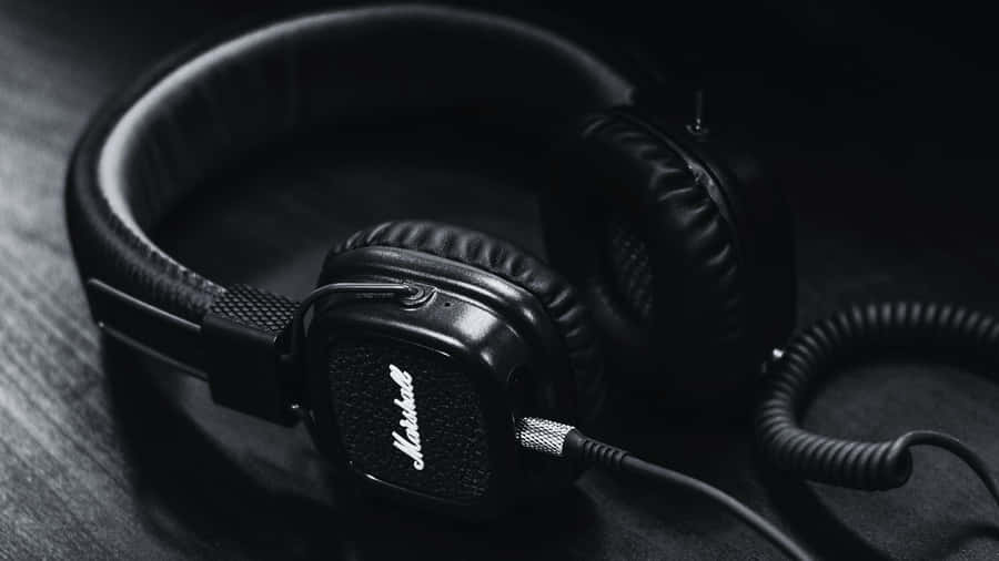 A Powerful Black And White Music-themed Background Wallpaper