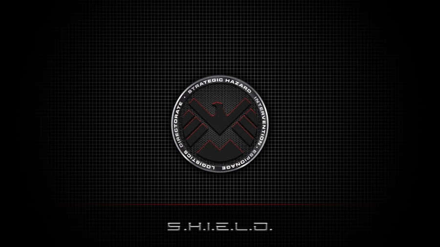 A Powerful Shield On A Regal Red Background Wallpaper