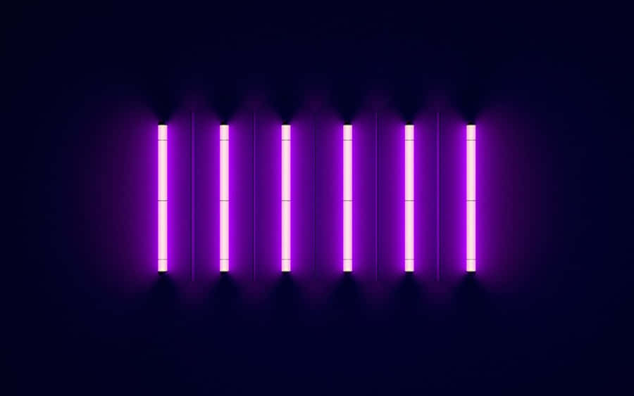 A Purple Light Is Shown On A Dark Background Wallpaper