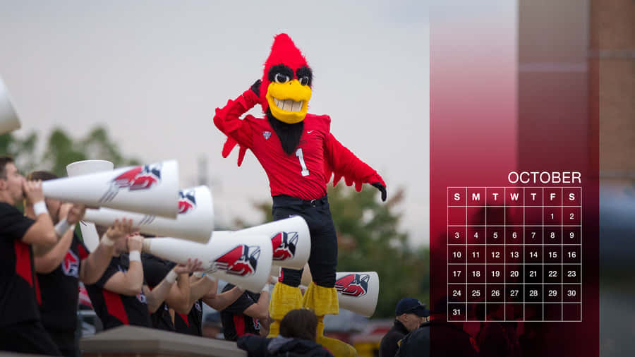 A Red Cardinal Mascot Is Holding A Horn Wallpaper