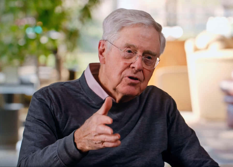 A Reflective Moment Of Charles G. Koch Wallpaper