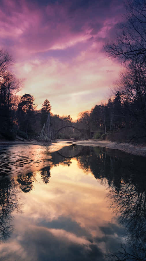 A River With Trees In The Background Wallpaper