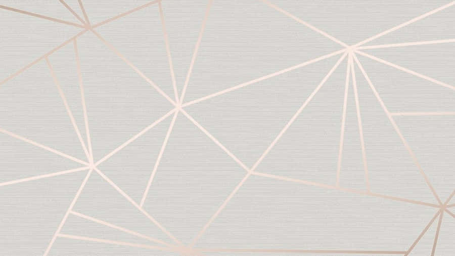 A Rose Gold Computer Sits Atop A Mahogany Desk. Wallpaper