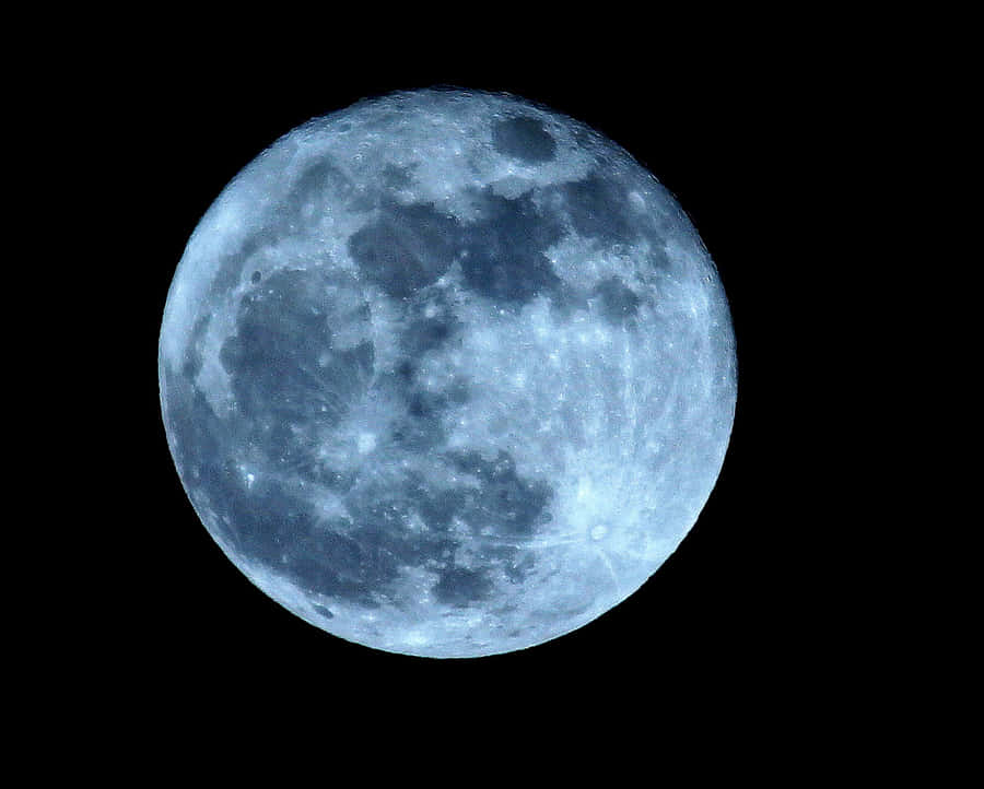 A Serene View Of The Waning Gibbous Moon Wallpaper