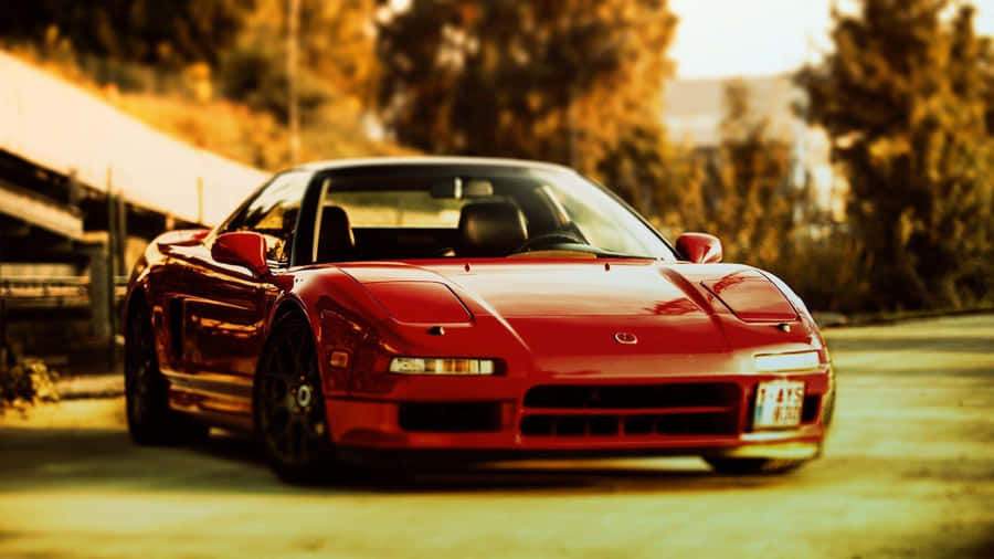 A Sleek Acura Nsx In Motion On The Open Road Wallpaper