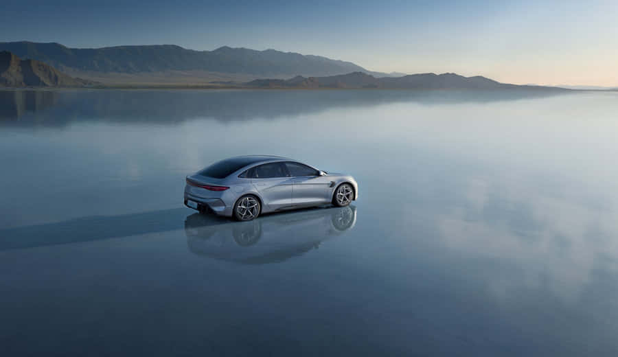 A Sleek Byd Electric Vehicle On The Open Road Wallpaper