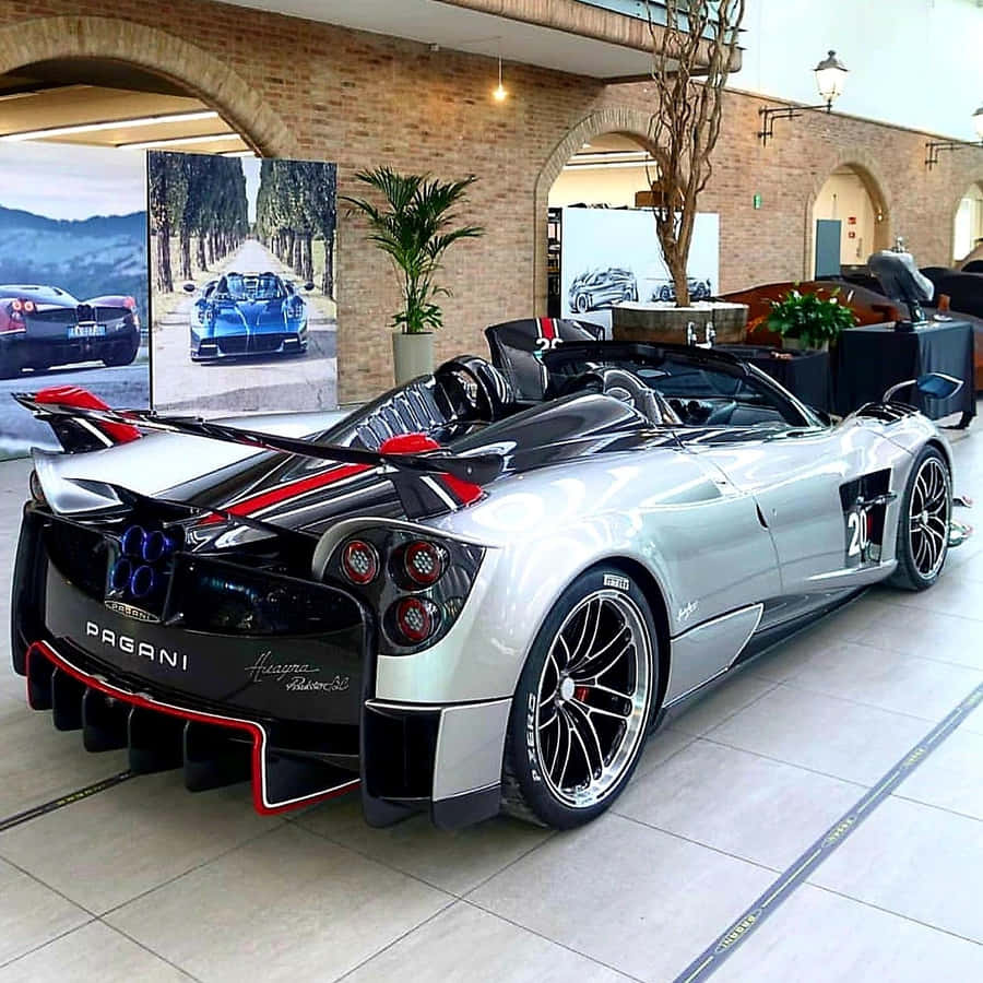 A Sleek Pagani Zonda C12 Roadster Parked In The Sun Wallpaper