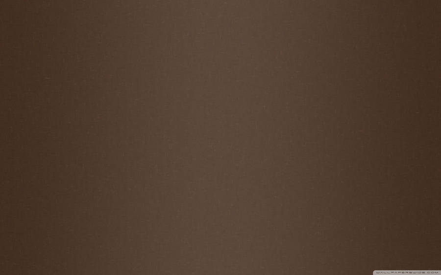 A Smooth And Dark Brown Backdrop Wallpaper