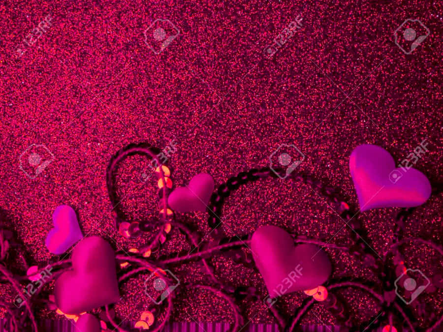 A Sparkling Pink Heart Shines Hope In The Darkness Wallpaper