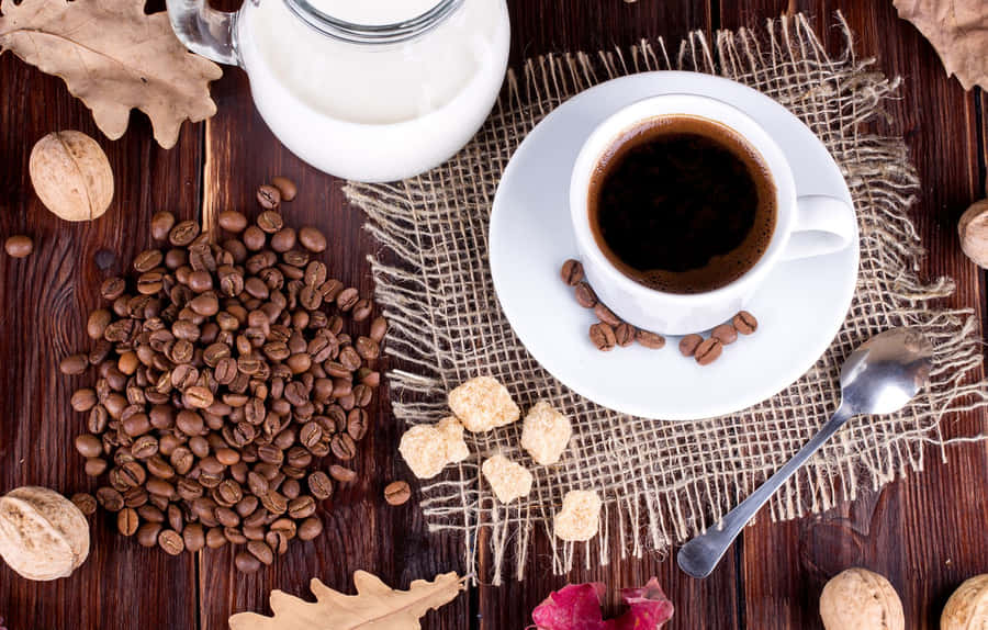 A Splash Of Milk Merging With A Dark Coffee Wallpaper