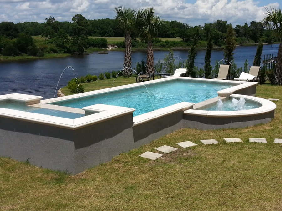 A Stunning Beachside Swimming Pool Wallpaper