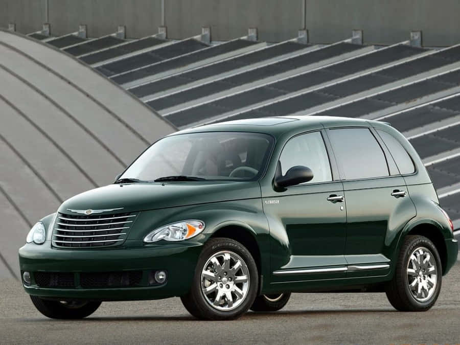 A Stunning Red Chrysler Pt Cruiser Parked Outdoors Wallpaper