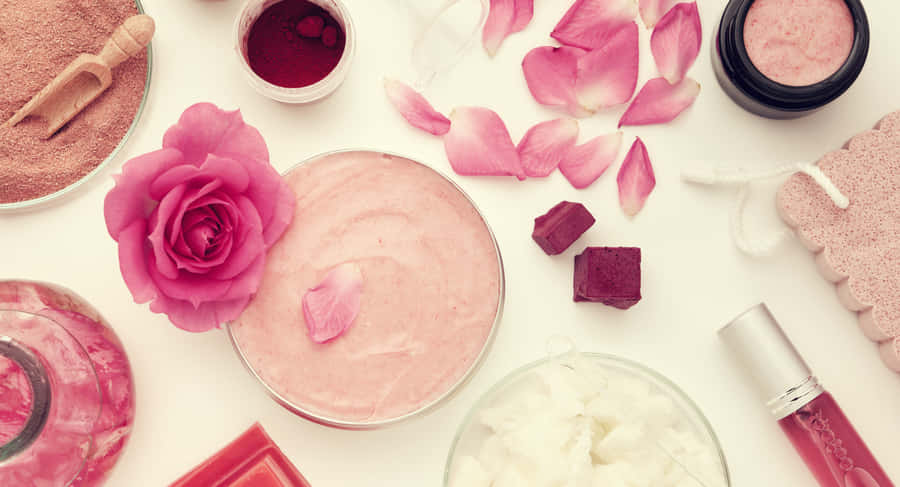 A Stunning Sunrise Overlooking A Calm Body Of Water Wallpaper