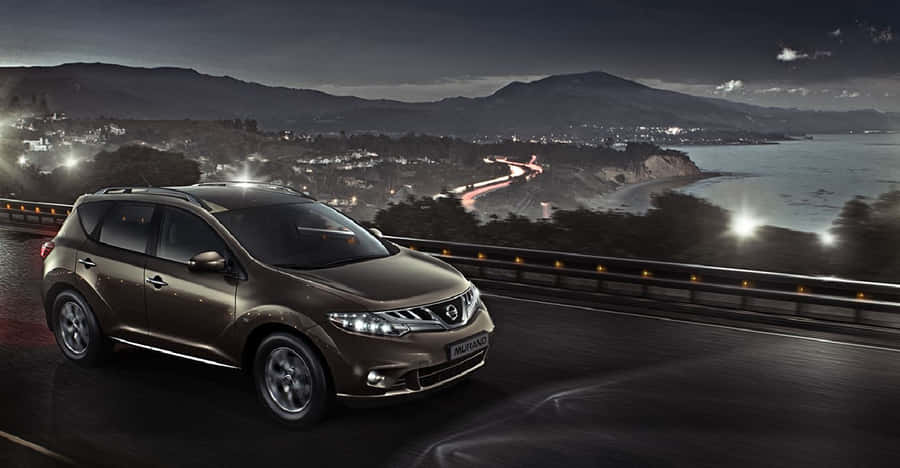 A Stylish Nissan Murano Suv On The Road Wallpaper