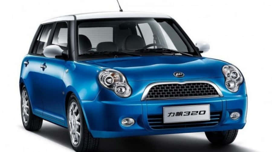 A Stylish White Lifan 320 Parked On A Paved Road. Wallpaper