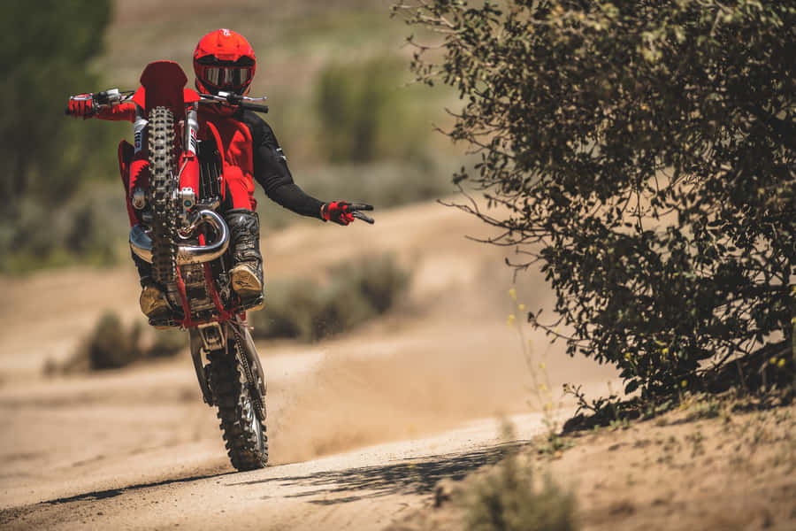 A Thrilling Ride On A Gas Gas Dirt Bike Wallpaper