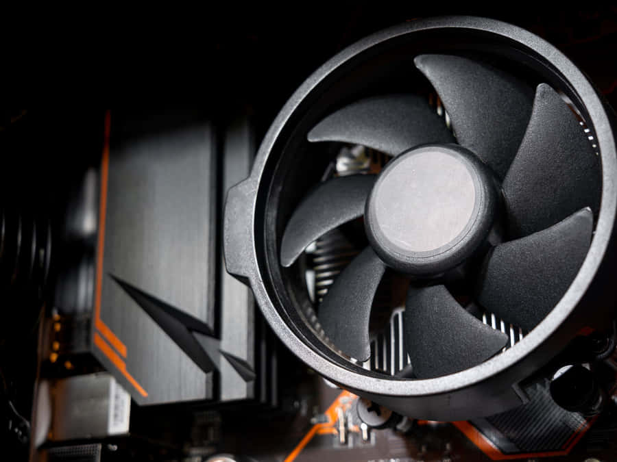 A Tranquil River Valley Surrounded By Lush Trees And Hilly Terrain Wallpaper