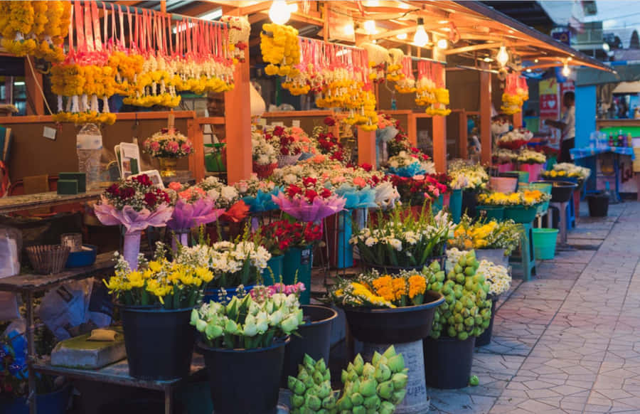 A Vibrant Flower Market In Full Bloom Wallpaper