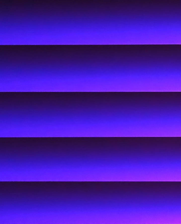 A Vibrant Striped Gradient Featuring Shades Of Purple Wallpaper