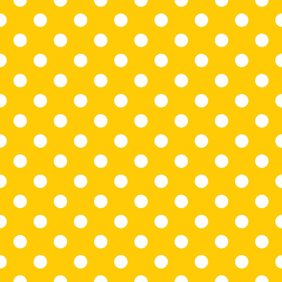 A Vibrant Yellow Polka Dot Pattern Wallpaper
