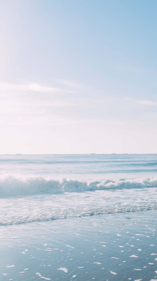 A Woman Is Standing On The Beach Wallpaper