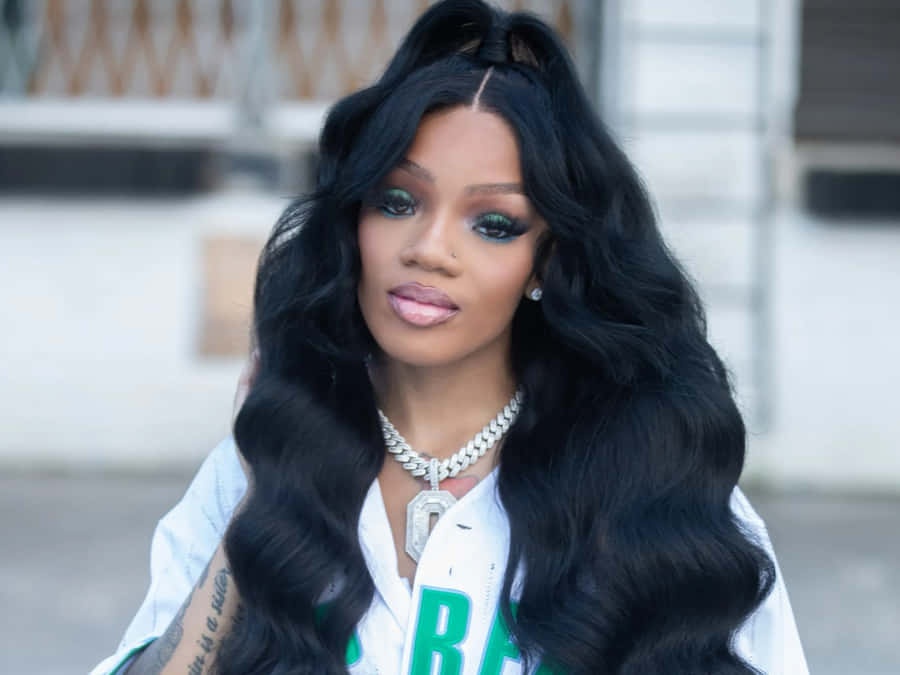 A Woman Wearing A Black Shirt And A Black Wig Wallpaper