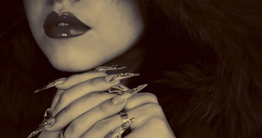 A Woman With A Fur Coat And A Ring On Her Finger Wallpaper