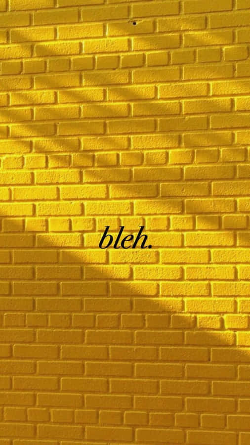 A Yellow Brick Wall With The Word Blh Wallpaper
