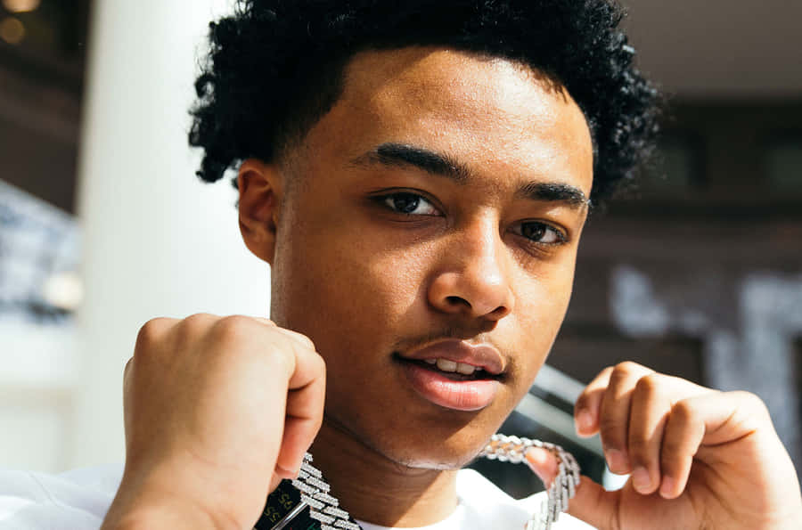 A Young Man With A Necklace On His Neck Wallpaper