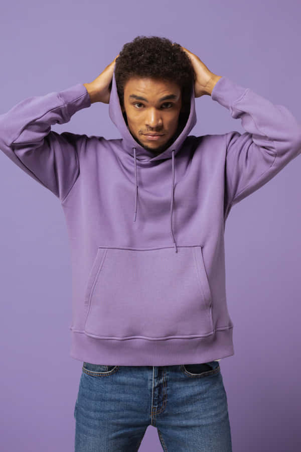 A Young Woman Wearing A Stylish Purple Hoodie. Wallpaper