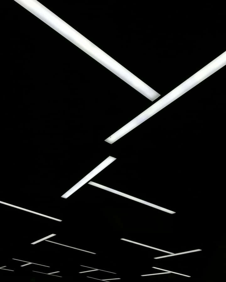 Abstract Fluorescent Lights Against Black Background Wallpaper