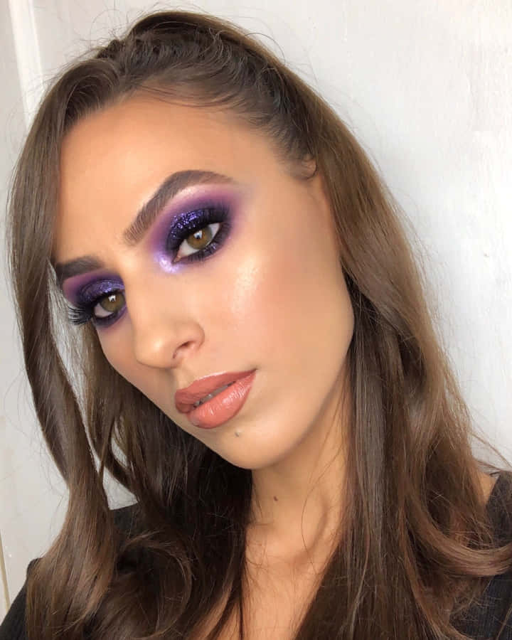 Achieve A Glittery Look This Christmas With Purple Eye Shadow Wallpaper