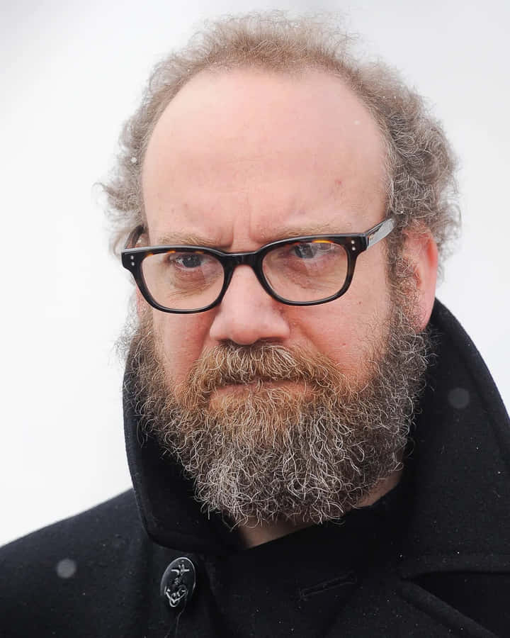 Actor Paul Giamatti Poses With A Cheeky Smirk. Wallpaper